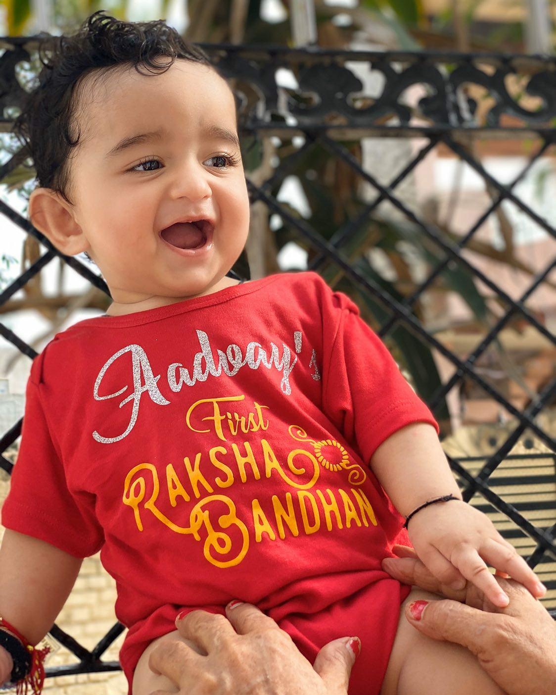 "Custom baby onesie with name and special design for photo shoots."