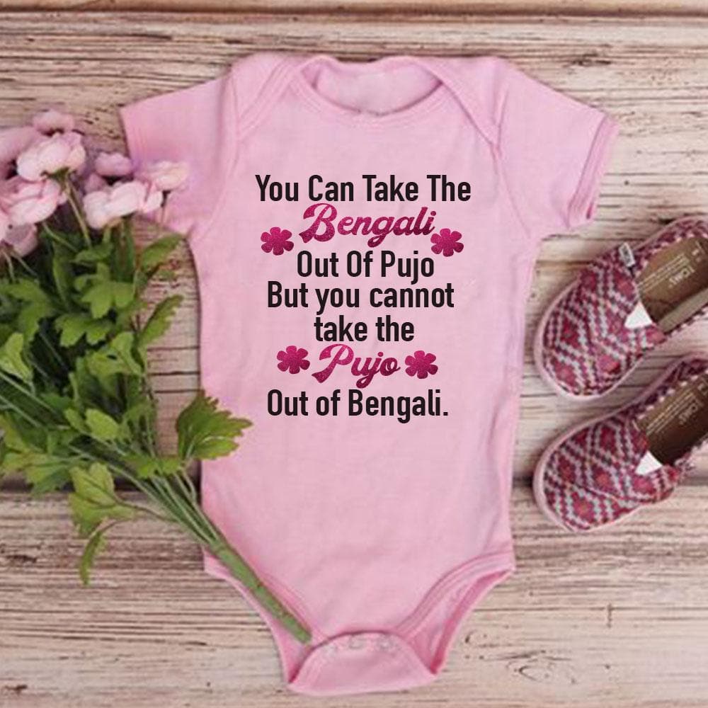 "Custom baby onesie with name and special Durga Puja design."