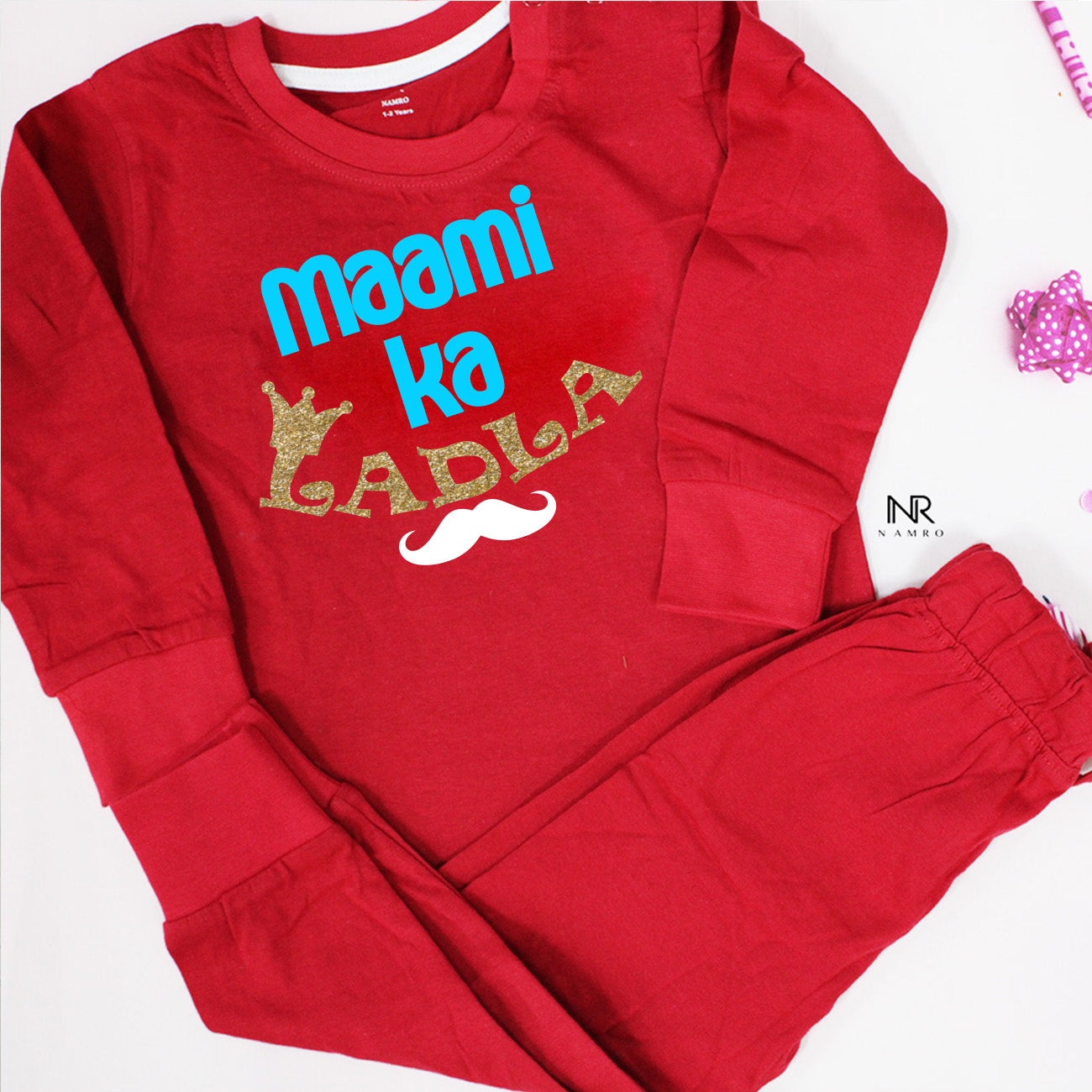 "Personalized baby outfit with custom name and playful design."