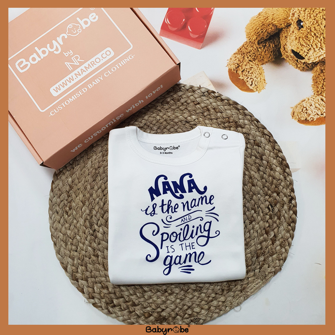 "Personalized baby jumpsuit with custom name and playful design."