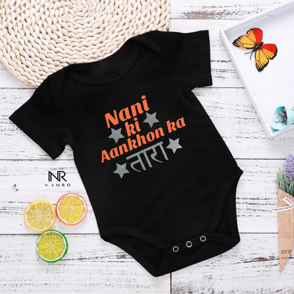 "Cute baby romper with a custom graphic and soft cotton fabric."