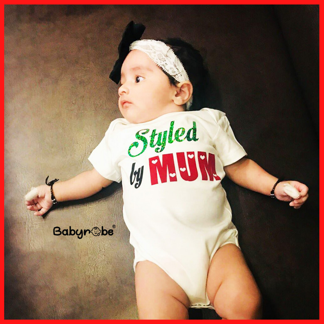 "Personalized baby onesie with colorful design and easy snap closures."