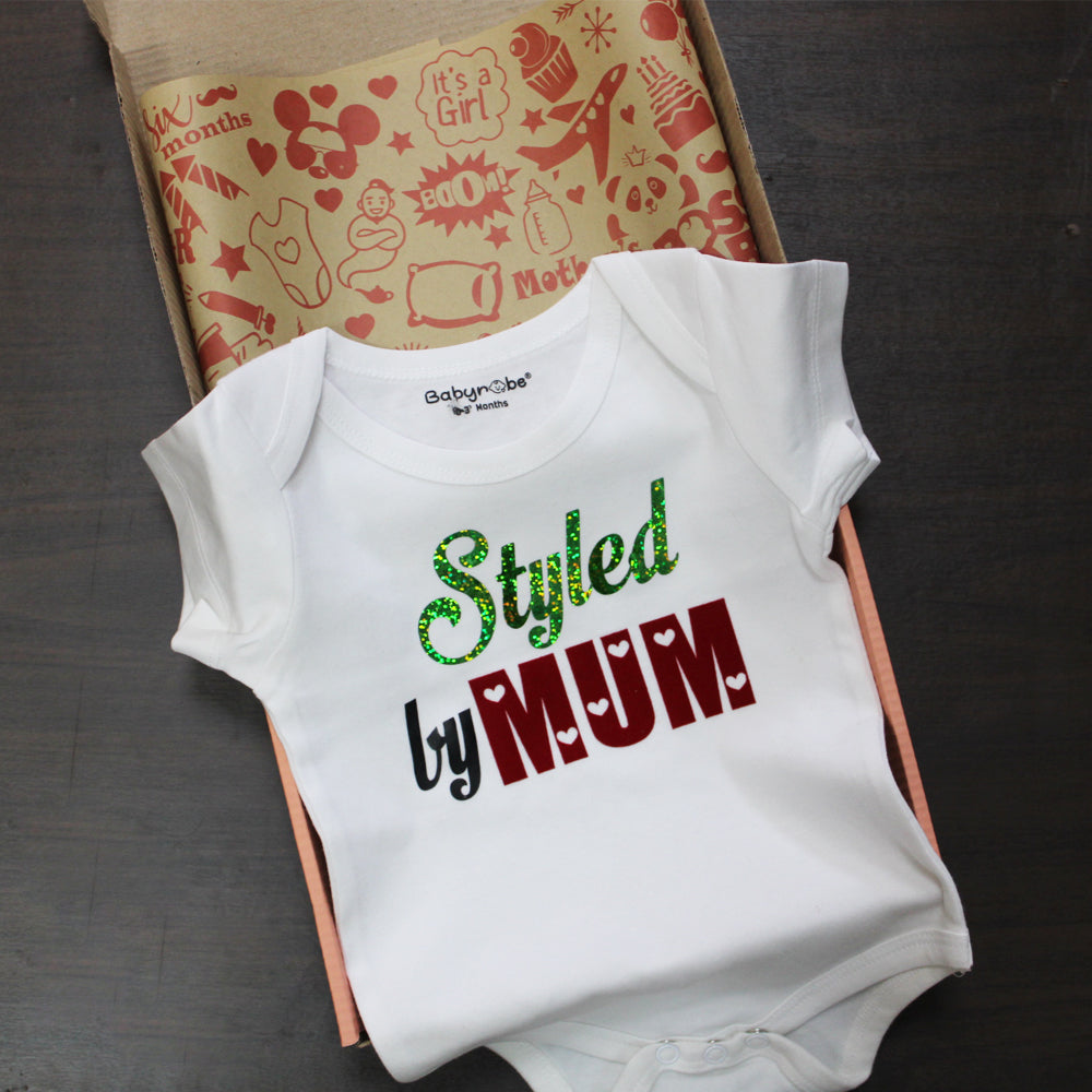 "Cute baby romper with a custom graphic and soft cotton fabric."