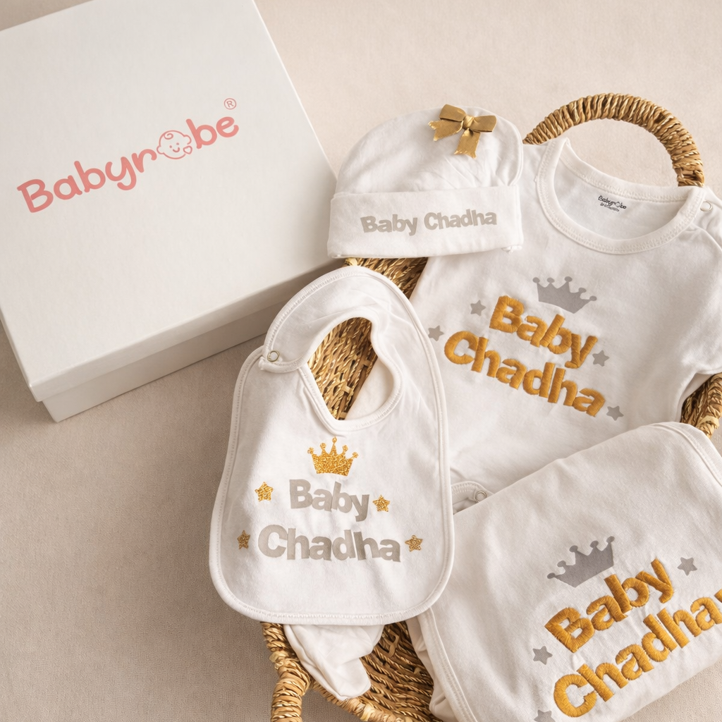 Baby gift set with bibs, hats, and a basket on a beige background