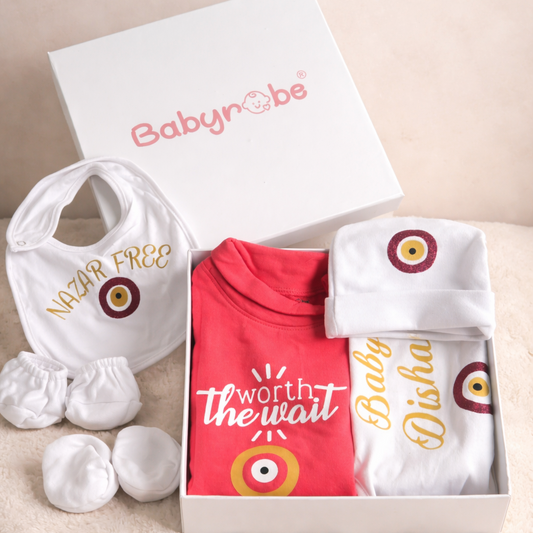 Baby gift set with red shirt, bib, and booties in a Babynrobe box.