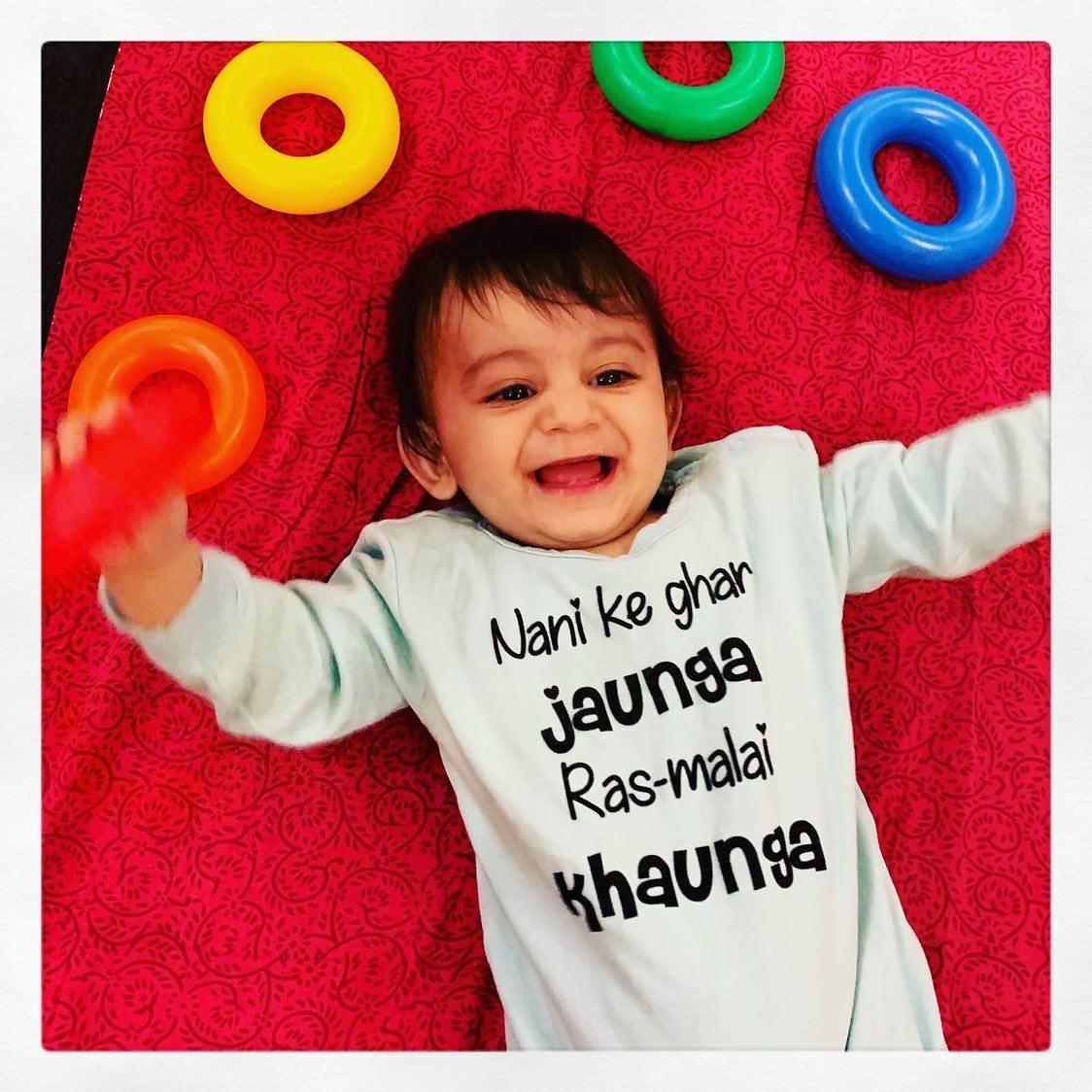 "Custom baby jumpsuit with name and special design for gifts or photo shoots."
