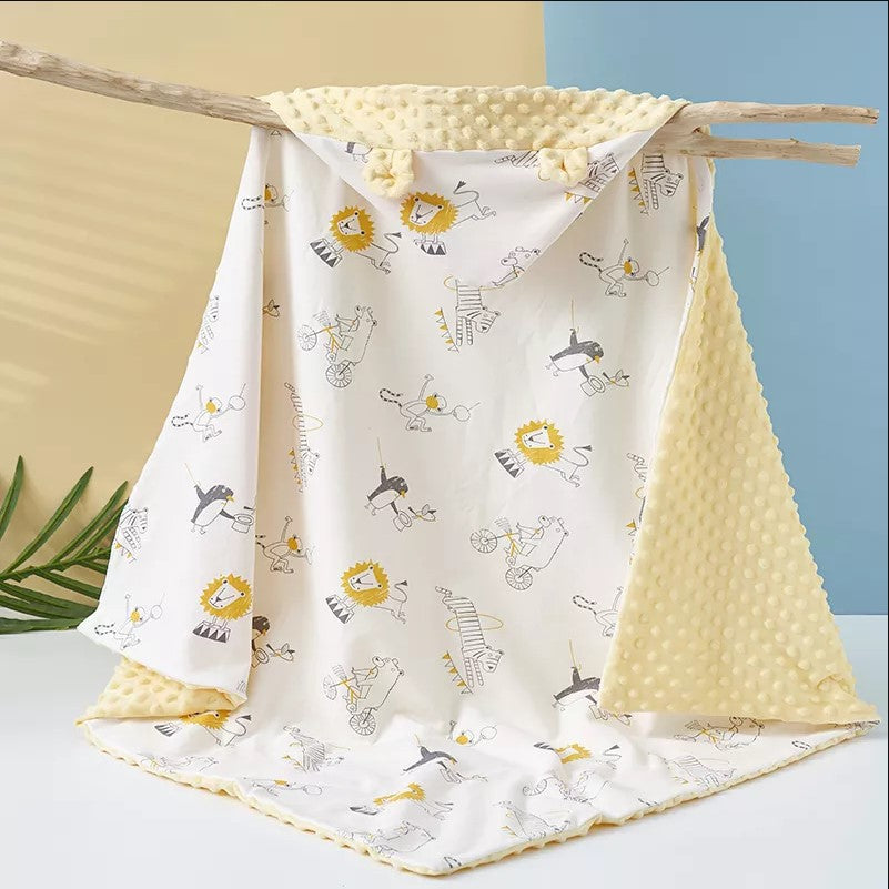 Baby lionminkyblanket with custom embroidery and playful pattern"