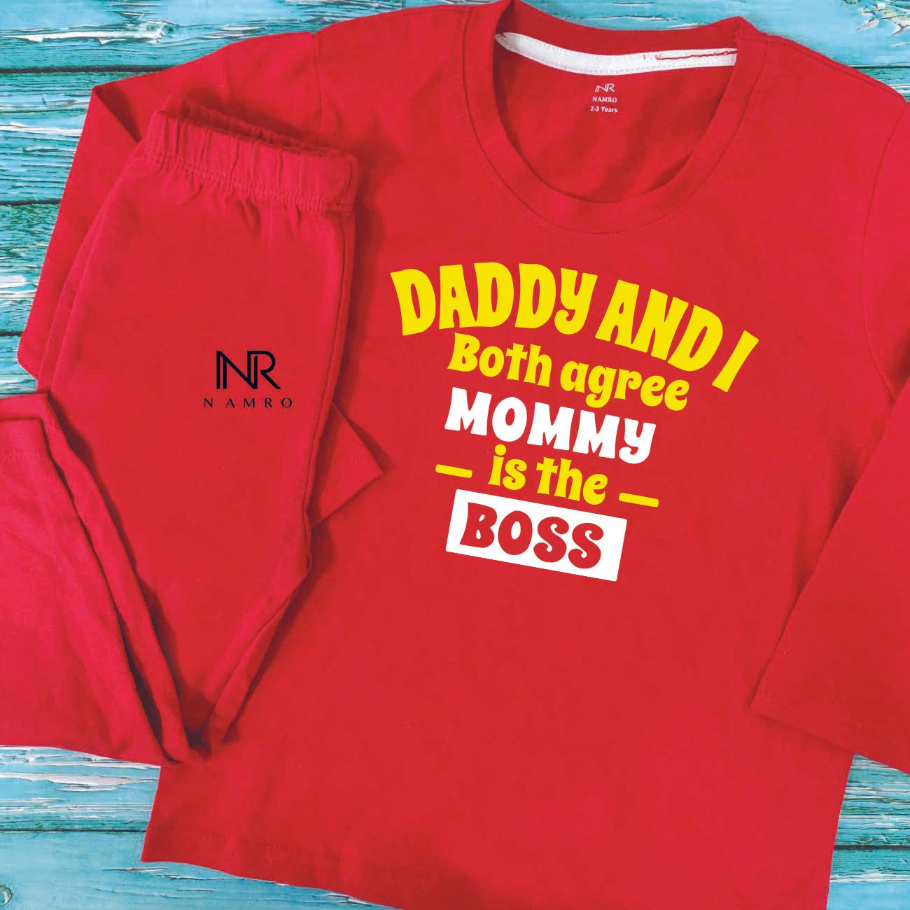 "Personalized baby T-Shirt & Pajama set with colorful design and easy snap closures."